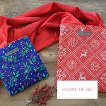 Load image into Gallery viewer, Blue Reusable gift bag, Berry and Green Foliage with Royal Blue Satin Bow makes storing and reusing this gift bag an easy sustainable zero-waste choice - EverWrap
