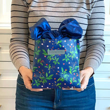 Load image into Gallery viewer, Blue Reusable gift bag, Berry and Green Foliage with Royal Blue Satin Bow makes storing and reusing this gift bag an easy sustainable zero-waste choice
